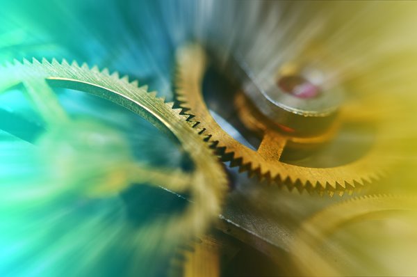 Turning cogs and wheels.