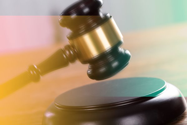 A gavel being hit in a courtroom.