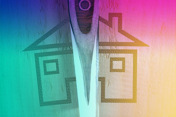 A house logo on a wooden box being split in two.