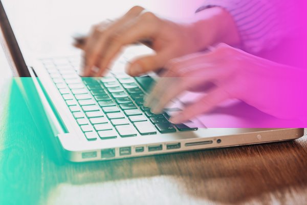A person typing on a laptop.