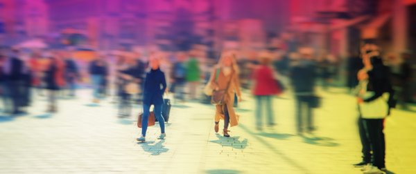 A crowd of people in a city square.