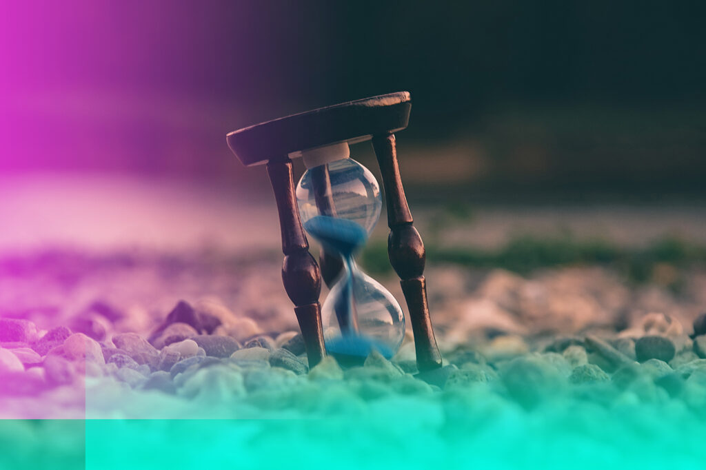 Hourglass with sand flowing.