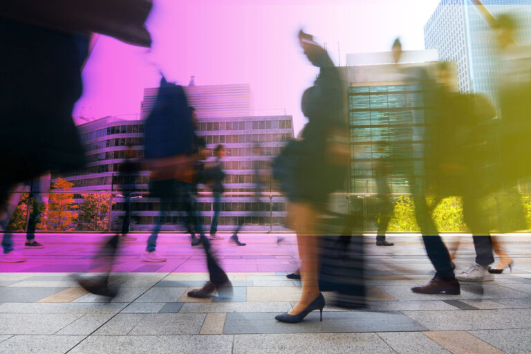 A busy street with people walking.