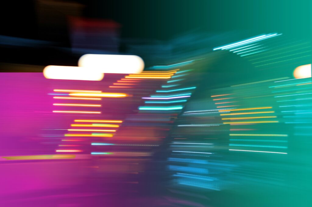 Blue pink and yellow blured strobe lights.