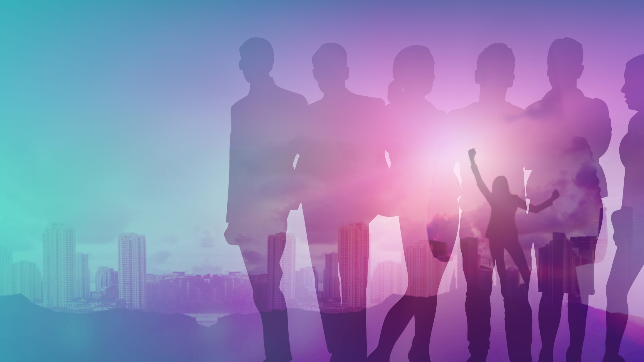 A group of people standing together with a city in the background.