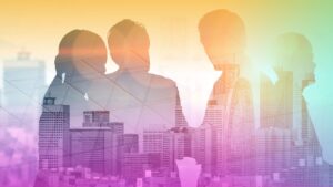 A group of people in a city with buildings.
