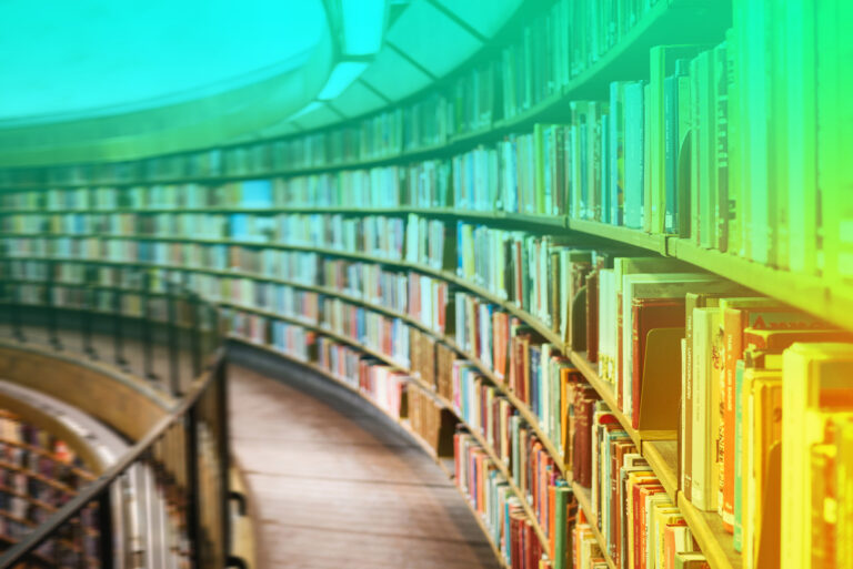 Curved library shelves full of books.