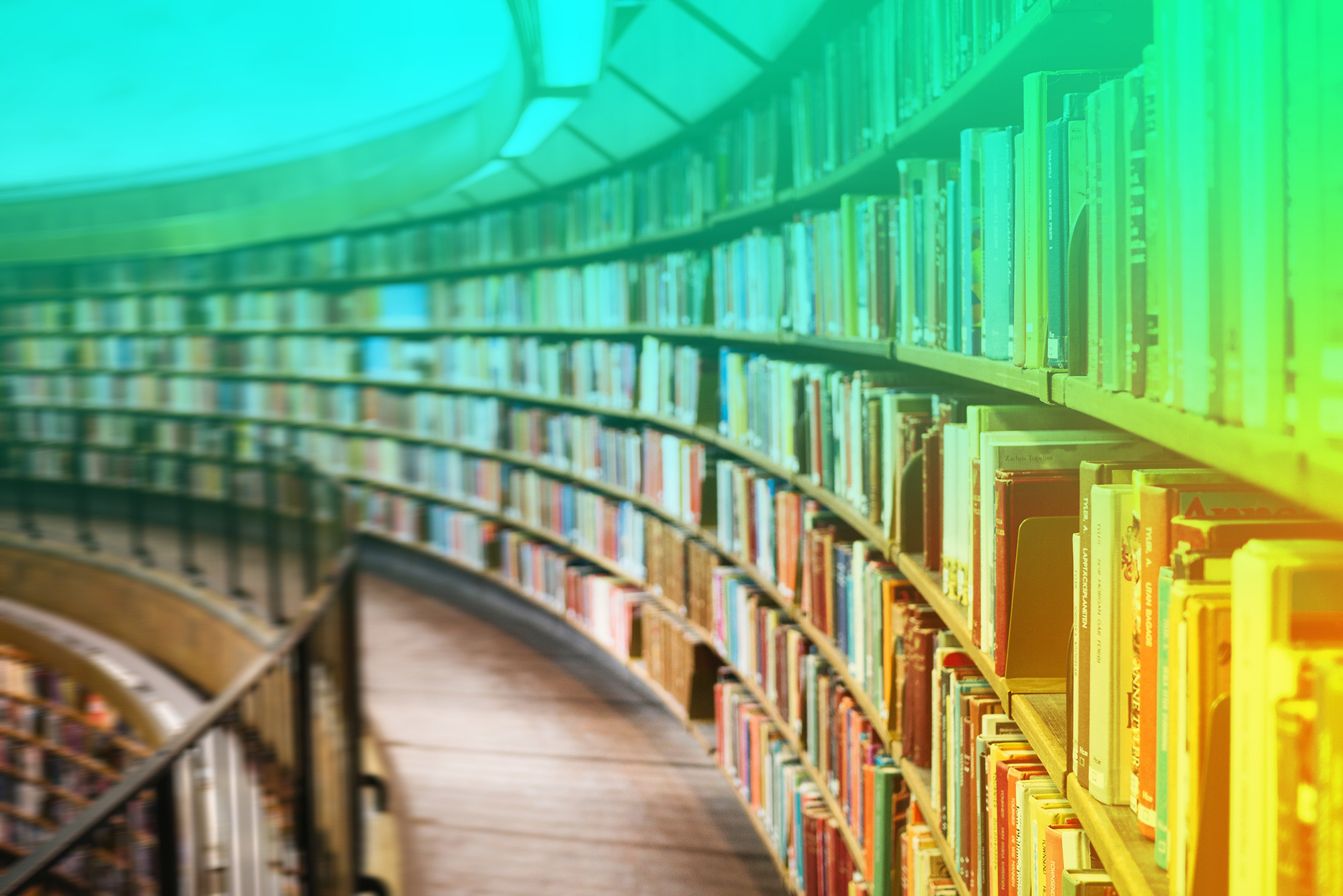 Curved library shelves full of books.