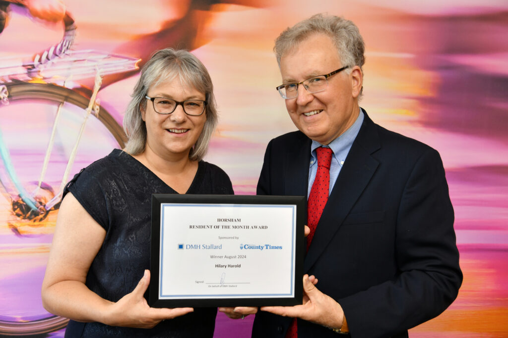 Nigel Winter presenting Hilary Harrold with the Horsham Resident of the Month Award for August 2024